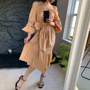 Rustic ballon sleeved poplin dress with bow. Zara